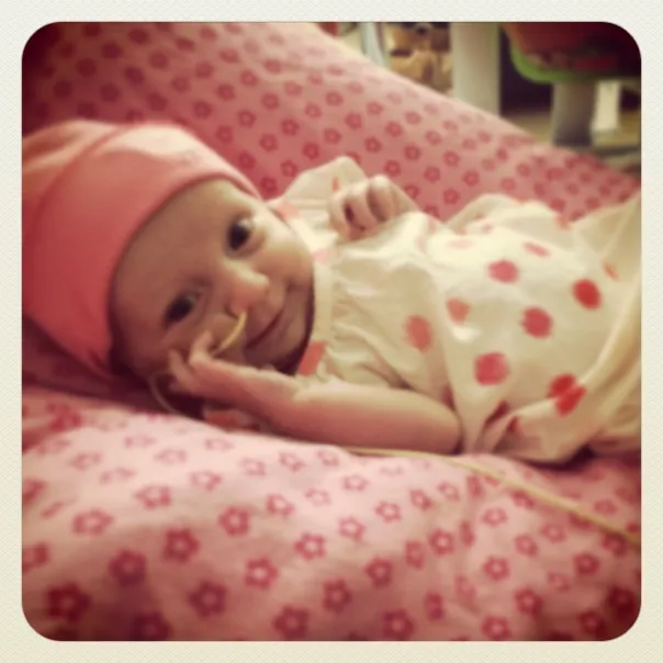 Leyden smiling wearing pink hat
