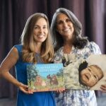 Leslie and Jennifer holding Forever Our Little One and a picture of Micah