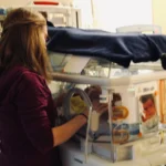 Jenn with Micah in the NICU
