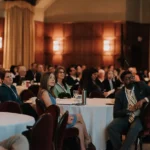People in audience at the NEC Society medical conference