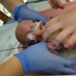 Nora getting bath in NICU