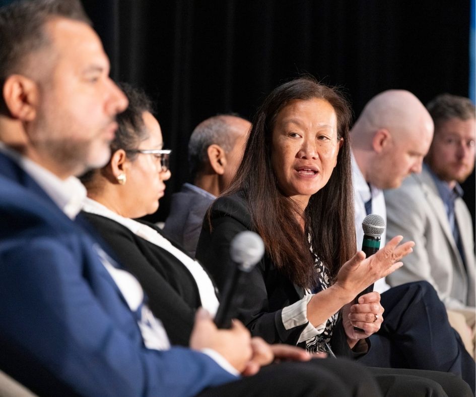 panel speakers holding mics