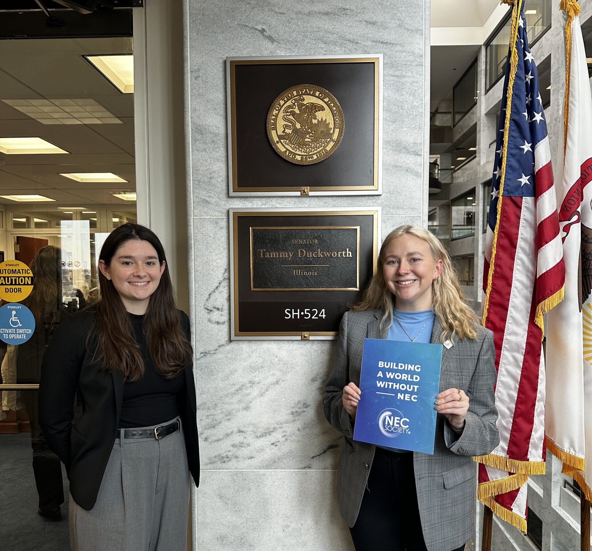 two women in front of a congressional office