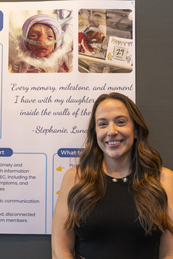 woman in front of a poster about her daughter