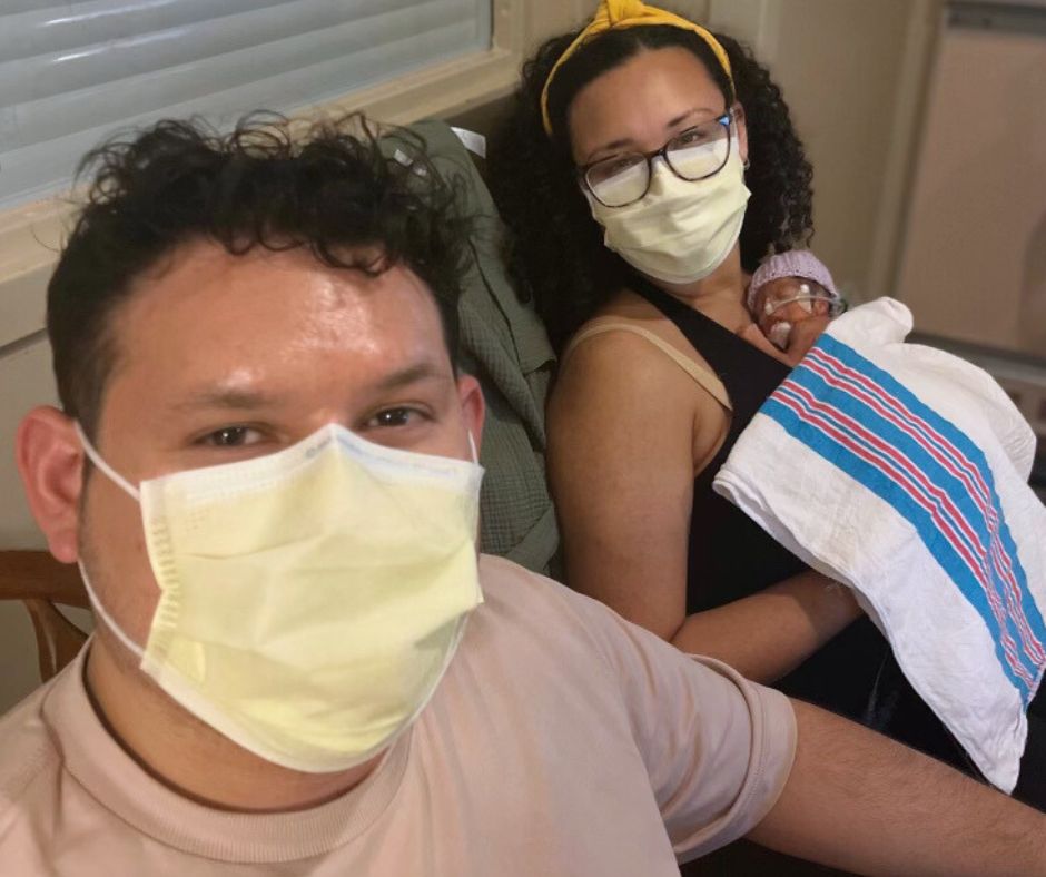 family holding their baby girl